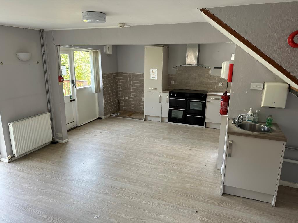 Lot: 9 - FORMER CAFÉ AND CARE FACILITY IN HIGH STREET - Lower Ground Floor Kitchen with access into garden